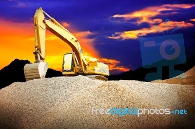 Excavator In Dusk Stock Photo