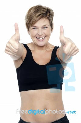 Excited Attractive Fit Lady Showing Double Thumbs Up Stock Photo