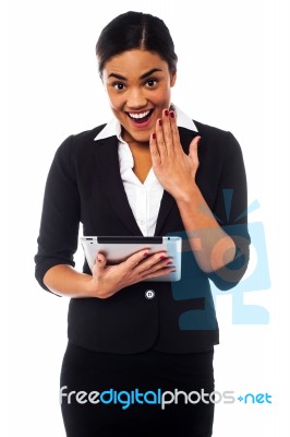 Excited Businesswoman Holding Touch Pad Stock Photo
