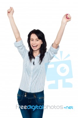 Excited Young Woman Celebrating Her Success Stock Photo