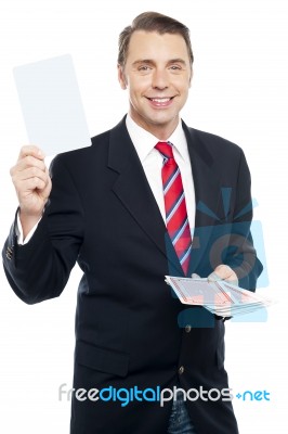Executive Showing Blank Playing Card To Camera Stock Photo