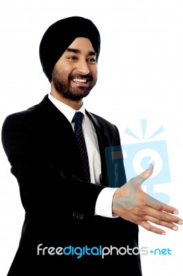 Executive Welcoming With A Handshake Stock Photo