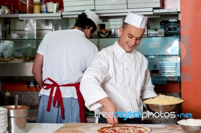 Expert Chefs At Work Inside Restaurant Kitchen Stock Photo