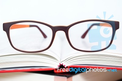Eyeglasses Closeup With Book Stock Photo