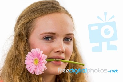 Face Of Girl With Flower In Her Mouth Stock Photo