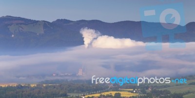 Factory Pollutes Clean Air Stock Photo