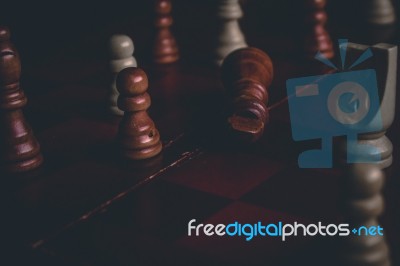Fallen King Piece On A Chess Board Stock Photo