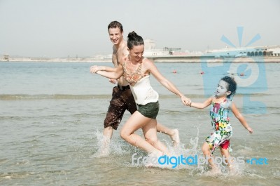 Family  In The Beach Stock Photo