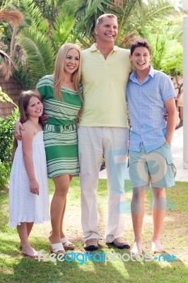 Family In Their Backyard At Home Stock Photo Family In Their Backyard At Home Stock Photo