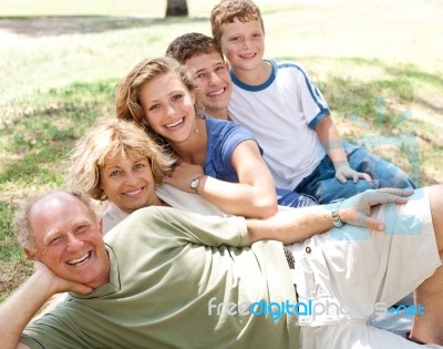 Family Laying In Line Stock Photo