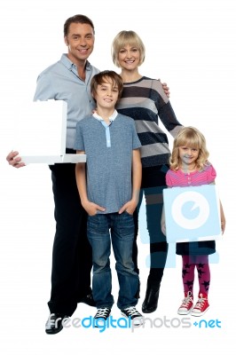 Family Of Four. Father And Daughter Holding Pizza Boxes Stock Photo
