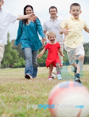 Family Playing Football Stock Photo