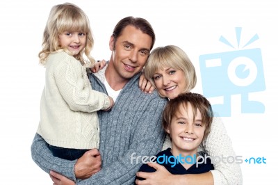 Family Portrait Of A Couple With Their Two Children Stock Photo