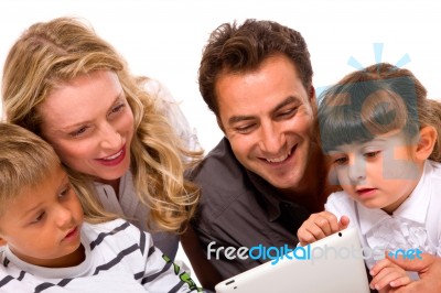 Family Using Digital Tablet Stock Photo