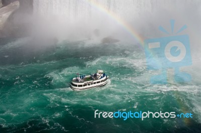 Fantastic Background With The Ship, Rainbow And Niagara Falls Stock Photo