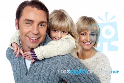 Father Giving Daughter A Piggyback Ride Stock Photo