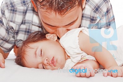 Father Kissing His Baby Sleeping Stock Photo