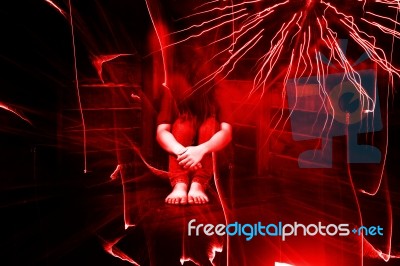 Fear Or Stressed Woman Sitting In Dark Room Surround With Spirit,ghost In Haunted House Stock Photo