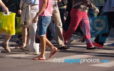 Feet Of The Pedestrians On City Street Stock Photo