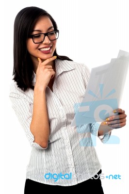 Female Analyzing Annual Business Reports Stock Photo Female Analyzing Annual Business Reports Stock Photo
