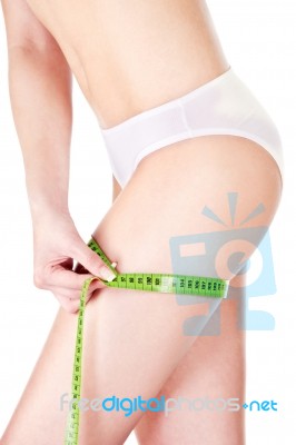 Female Body And Measure Tape Stock Photo