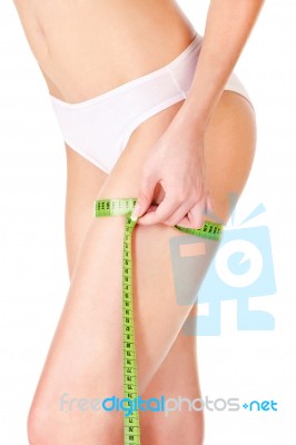 Female Body And Measure Tape Stock Photo