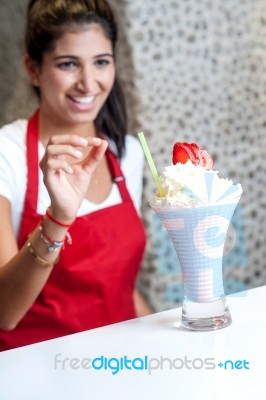 Female Chef Serving Strawberry Shake Stock Photo