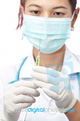 Female Doctor And Syringe Stock Photo