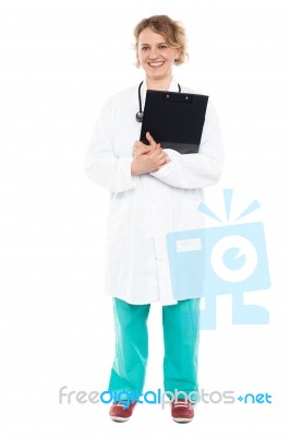 Female Doctor Holding Clipboard Stock Photo
