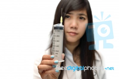 Female Doctor Holding Syringe Stock Photo