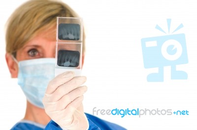 Female Doctor Looking At X-ray Stock Photo