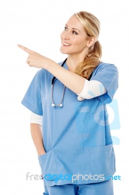 Female Doctor Pointing At Something Stock Photo