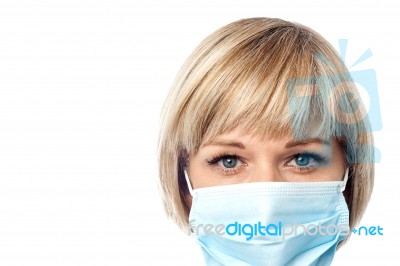 Female Doctor Wearing Surgical Mask Stock Photo