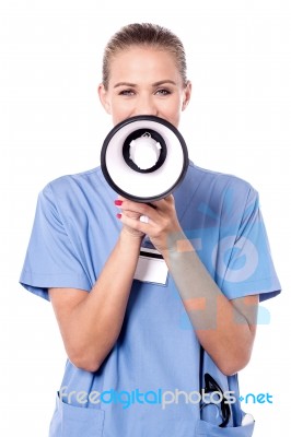 Female Doctor With Loudhailer Stock Photo