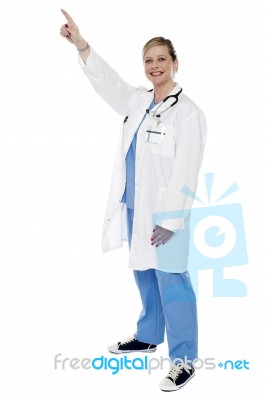 Female Doctor With Pointing Up Stock Photo