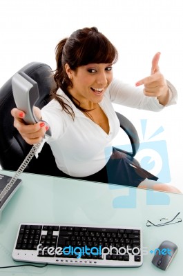 Female Giving Telephone Receiver Stock Photo