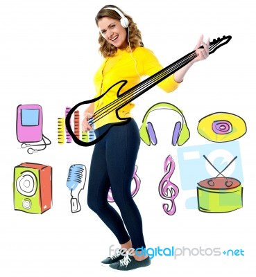 Female Guitarist In Full Action Stock Photo