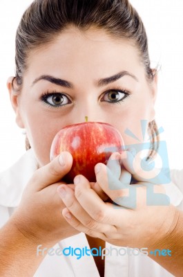 Female Holding Apple Near Her Face Stock Photo