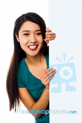 Female Model Holding Blank White Ad Board Stock Photo