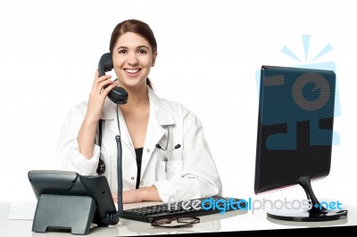 Female Physician Answering Phone Call Stock Photo