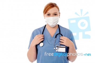 Female Surgeon Wearing Face Mask Stock Photo