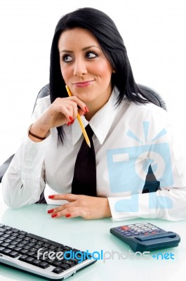Female Thinking And Holding Pencil Stock Photo