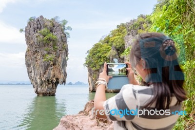 Female Traveler Shooting Natural View By Mobile Phone Stock Photo