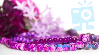 Feminine And Romantic Pearls And Flowers In Violet Tone Stock Photo