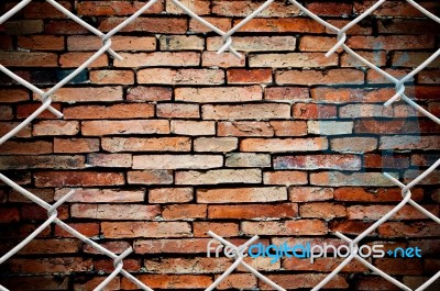 Fence And Brick Wall Stock Photo