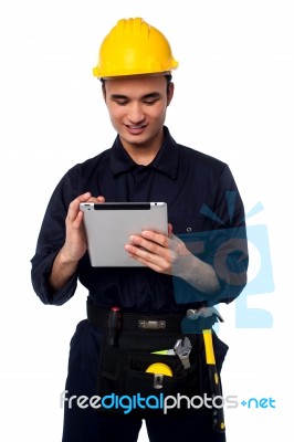 Field Worker Accessing Touch Pad Stock Photo