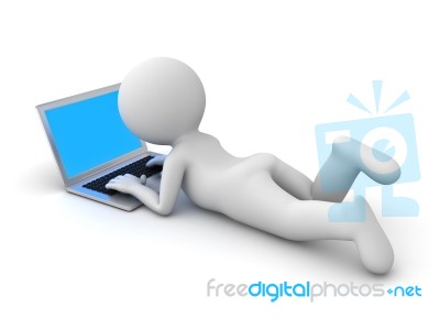 Figure Lying Down Using Laptop Stock Image