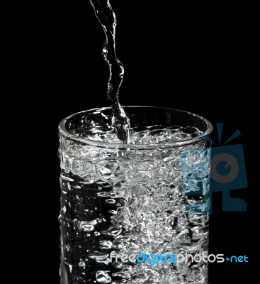 Filling Water Into Glass Stock Photo