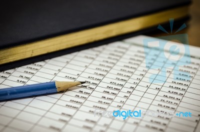 Financial Data Table And Book Stock Photo