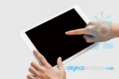 Finger Being Pointed On Tablet Screen Stock Photo